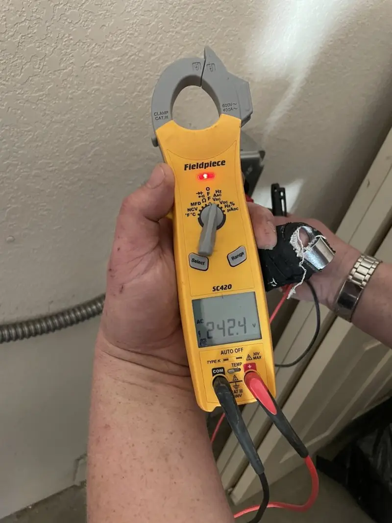 Voltage testing with clamp meter during Aluminum Wiring Replacement in Seguin